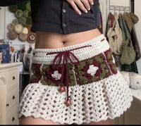 a woman wearing a crocheted skirt